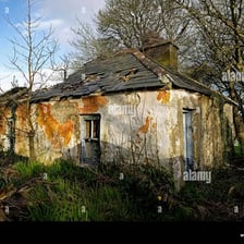A worn, neglected house in visibly poor condition.