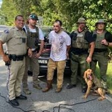 Police officers searching for a fugitive
