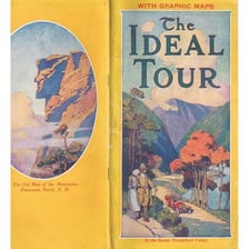 An open travel guide containing a map.