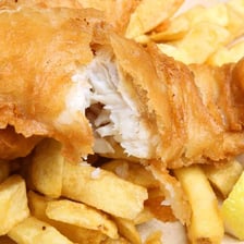 A serving of British fish and chips made with cod.