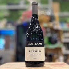 A bottle of Barolo wine with Piedmont vineyards in the background