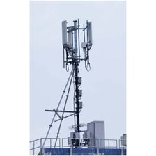 A telecommunications cell tower with antenna panels.