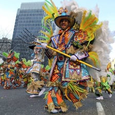 Marchers proceeding in a parade along a street
