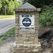 A town welcome sign displaying an established date