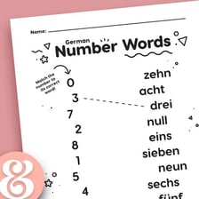 An educational display showing the German number words for three and nine.