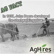 A historical steel plow associated with John Deere