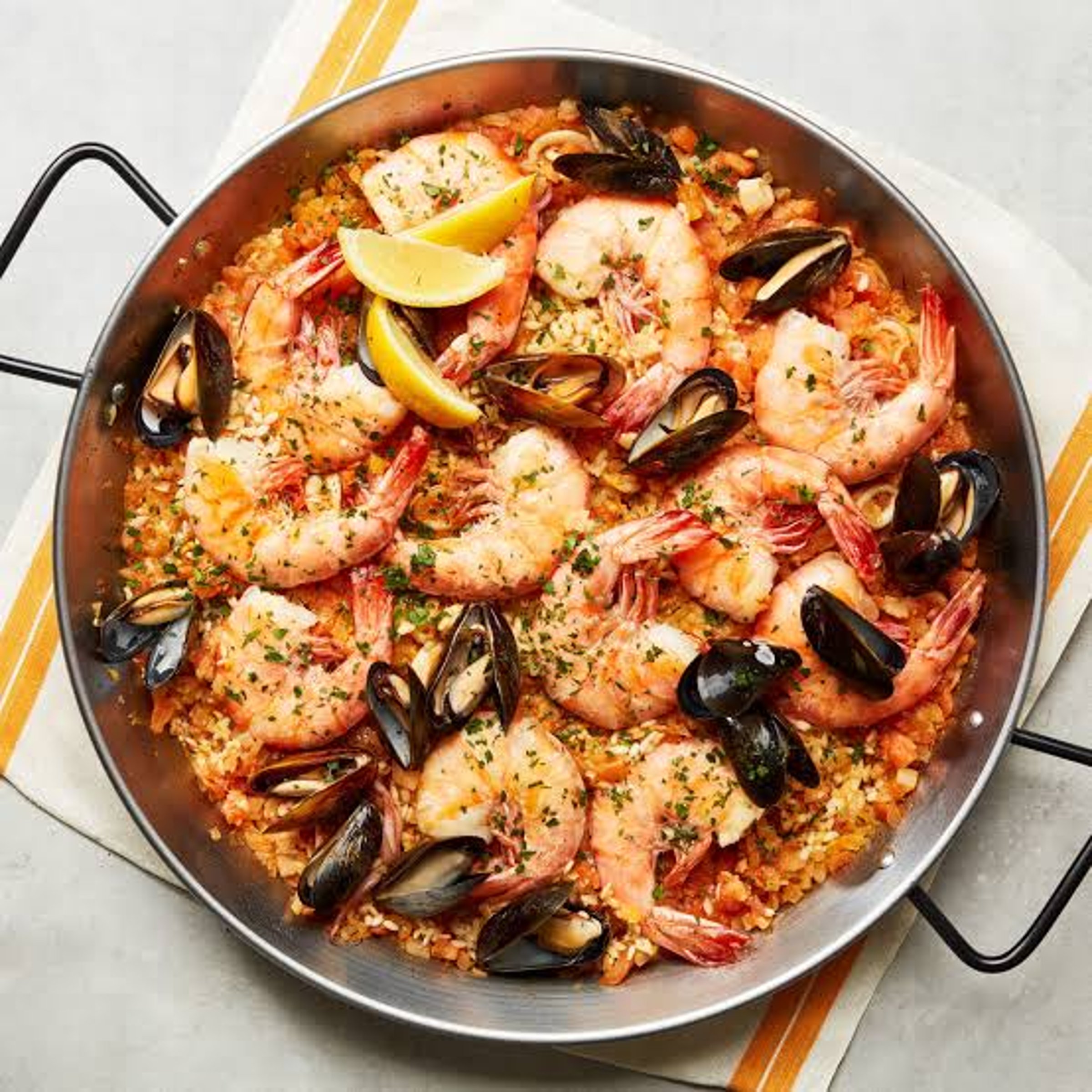 Spanish rice dish — NYT Midi Crossword Answer