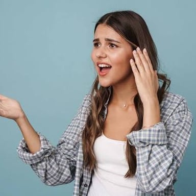 A person speaking with an unsteady, trembling voice
