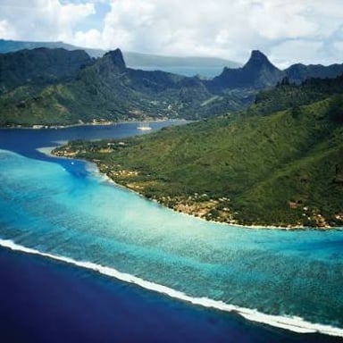 A small Polynesian coral islet surrounded by a tropical lagoon.