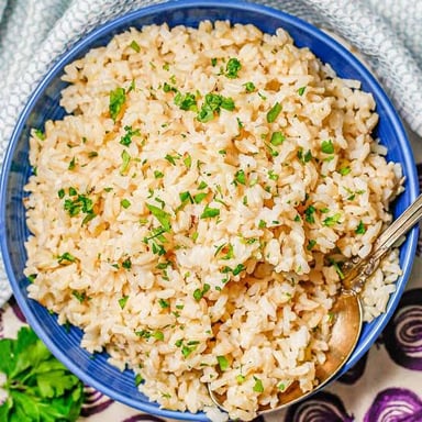 A bowl of cooked brown rice.