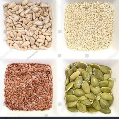 Sunflower seeds and sesame seeds shown together.