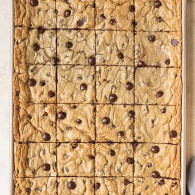 Several freshly baked cookies arranged on a baking sheet