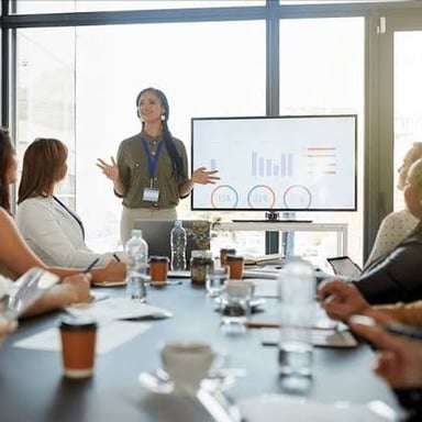 A person confidently delivering a successful presentation