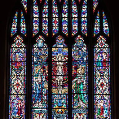 A cathedral window made of colored stained glass.