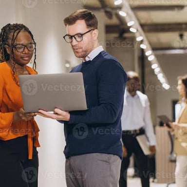 Two colleagues working together on a shared project