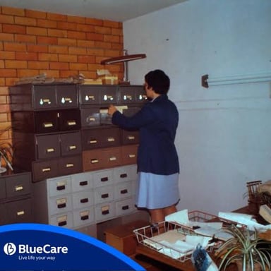Documents being placed in a filing cabinet.