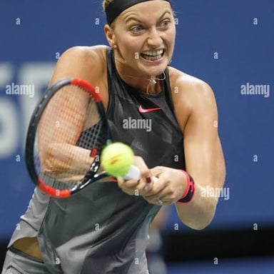 Petra Kvitová competing in a professional tennis match.