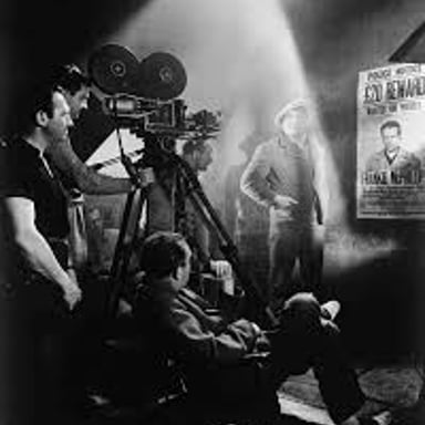 An actor performing prominently in a film scene.
