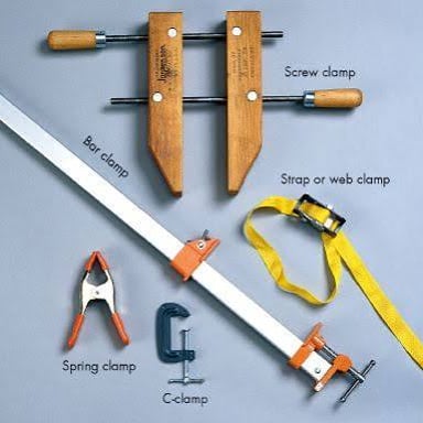 A hand tool being used to complete a repair.