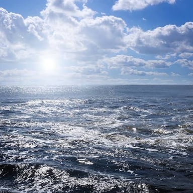 Small, irregular waves breaking across a choppy sea.