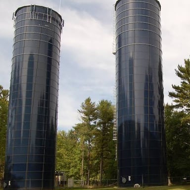 A tall vertical standpipe used for municipal water storage