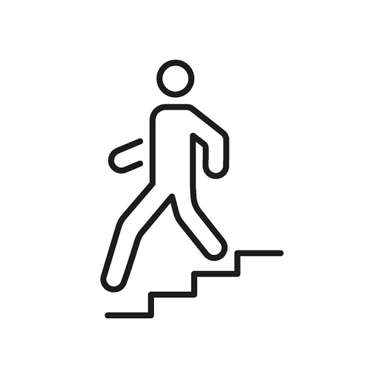 A person moving downward on a staircase.