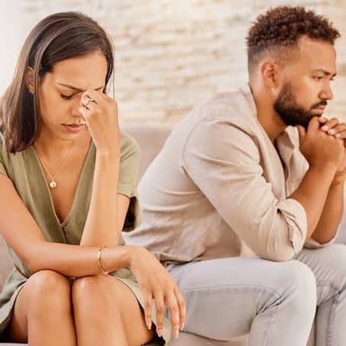 Two people speaking quietly in a private conversation.