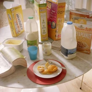 A person preparing breakfast during an ordinary daily routine.