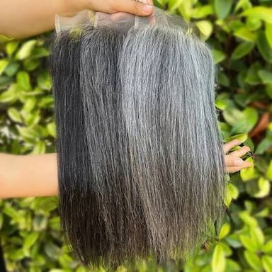 Close-up of hair with a mix of gray and darker strands.
