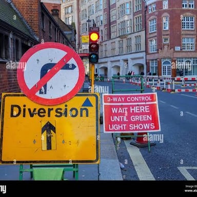 Road signs directing traffic onto an alternate route.