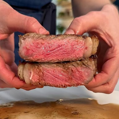 A sliced steak with a red center.