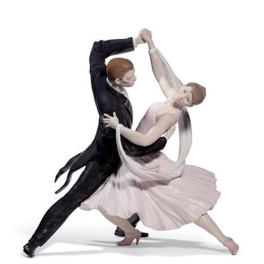 A formally dressed couple performing a foxtrot in a ballroom