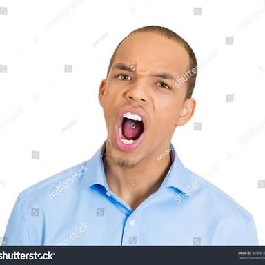 A person frowning with a displeased expression.