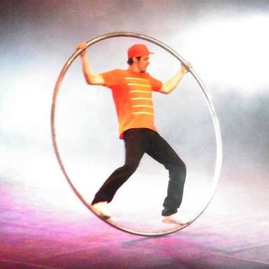 A dancer turning with a circular movement.