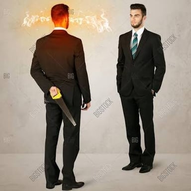 A person keeps an object out of sight behind their back.