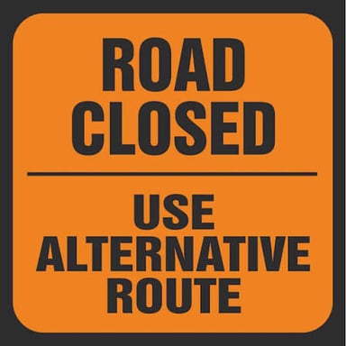 A detour sign directs traffic onto an alternate route.