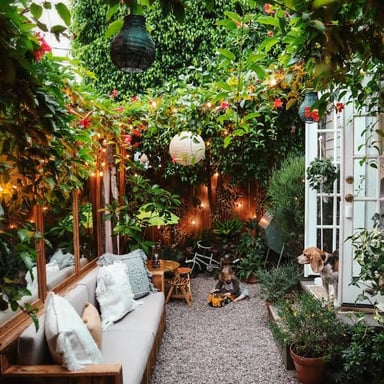 A landscaped garden patio with comfortable outdoor seating.