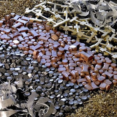 A person sorting discarded metal at a scrap yard.