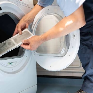 An empty lint filter removed from a clothes dryer.