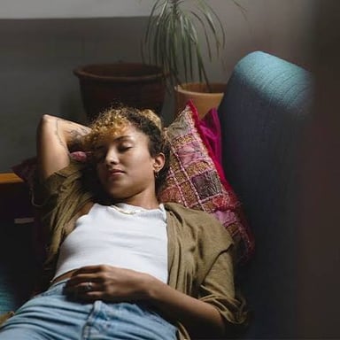 A person resting in a visibly lethargic state