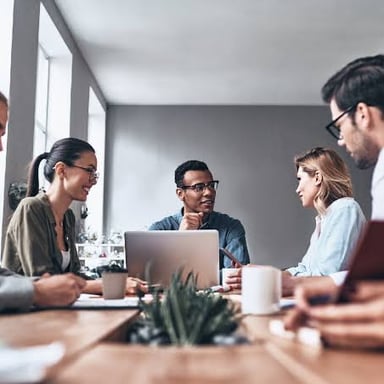 A group of employees working together in an office.