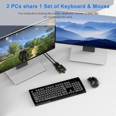 A computer keyboard, mouse, and printer arranged beside a computer.