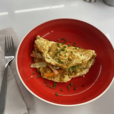 A folded omelette served on a plate