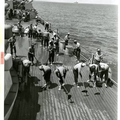 Enlisted sailors working aboard a naval ship