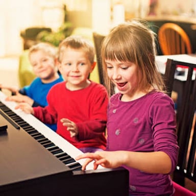 A child practicing a musical instrument during a lesson