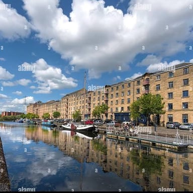 A waterfront quay with boats moored beside the landing platform.