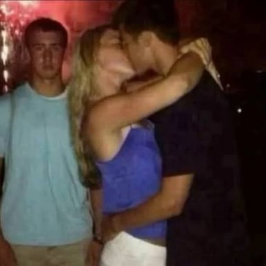 A couple on a date with another person sitting beside them.