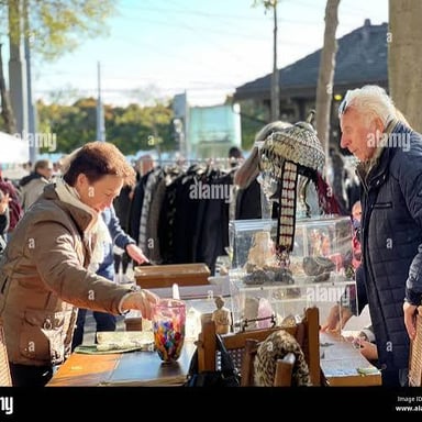 A customer and vendor negotiating a price at a market.