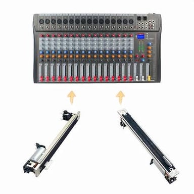 Close-up of a mixing console with vertical sliding fader controls