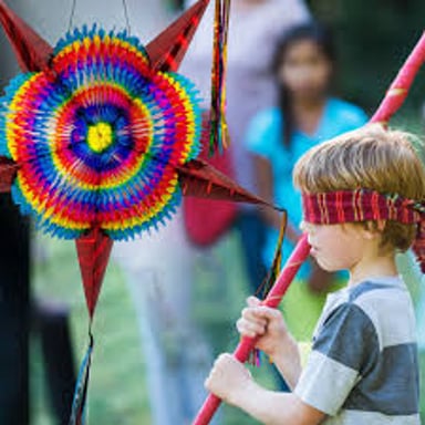 A colorful piñata hanging at a festive party.